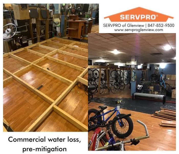 Bicycle shop showroom with buckled wood plank floors after a flood