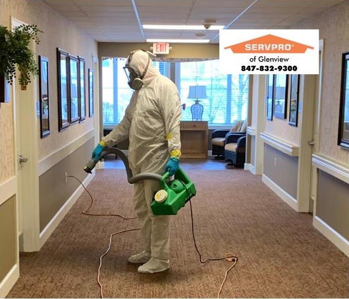 SERVPRO professional wearing PPE during a cleaning job